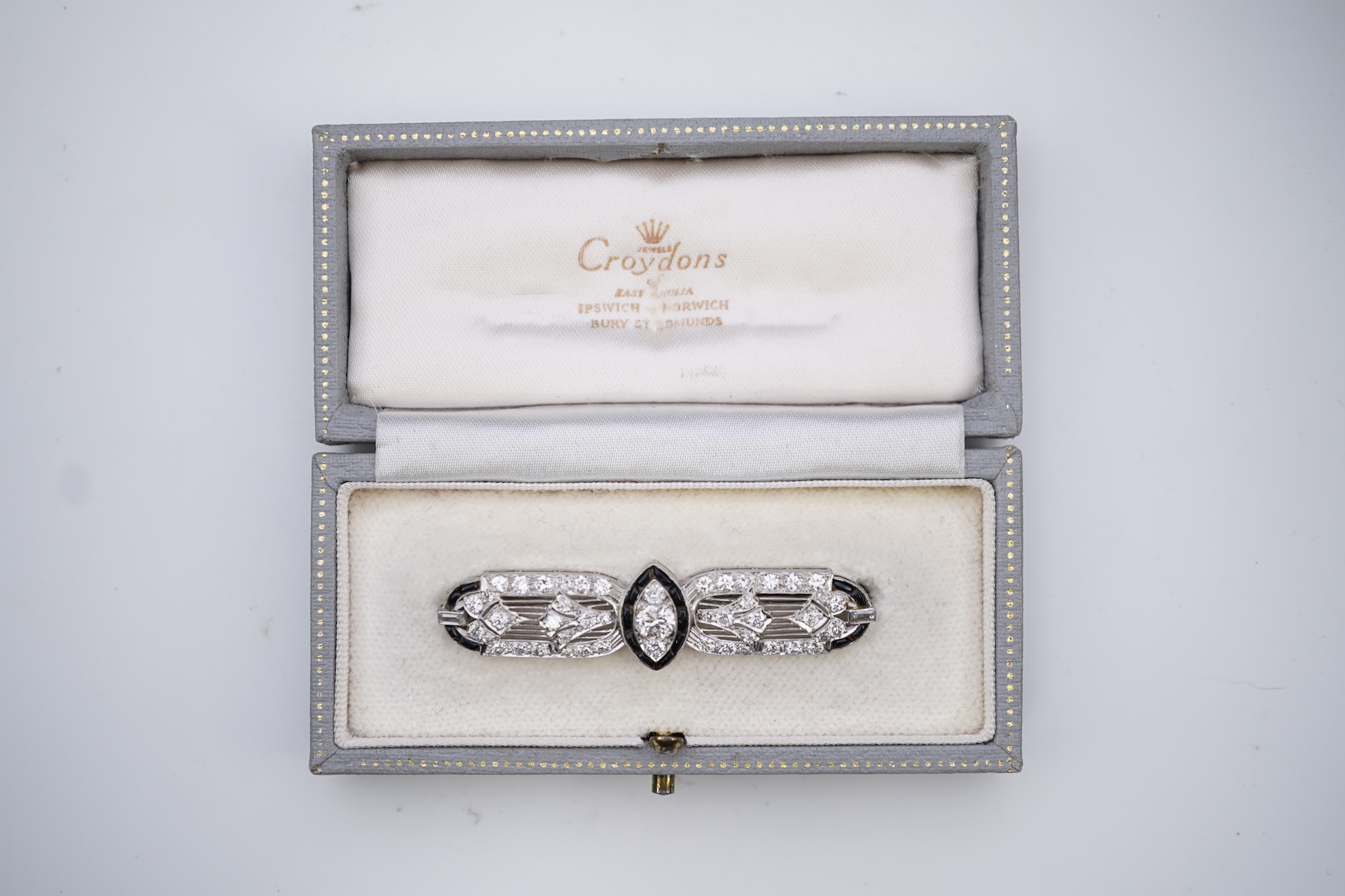 An Art Deco onyx and diamond brooch, 1920s